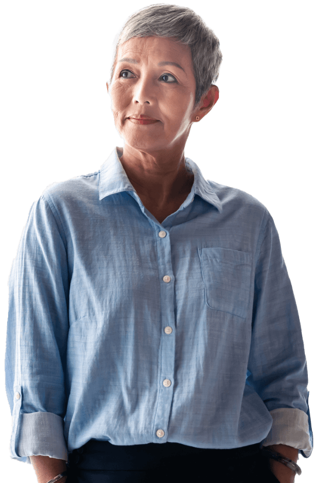A smiling woman in a blue linen button up shirt.