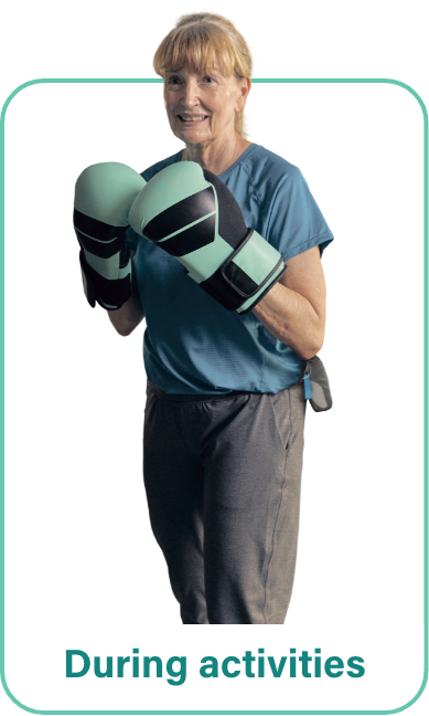 A woman in boxing gloves with a VYALEV pump carry case around her hip.