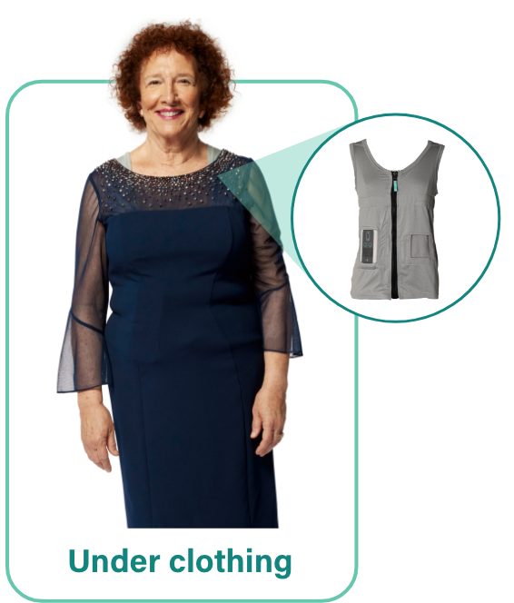A woman with a VYALEV pump carrying case vest on underneath her dress.